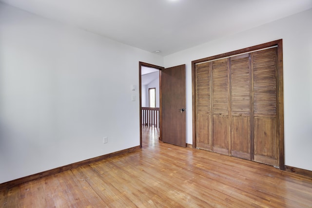 8210 Pine Grove Dr, East Stroudsburg, PA 18301 - unfurnished bedroom featuring light wood-style floors, baseboards, and a closet
