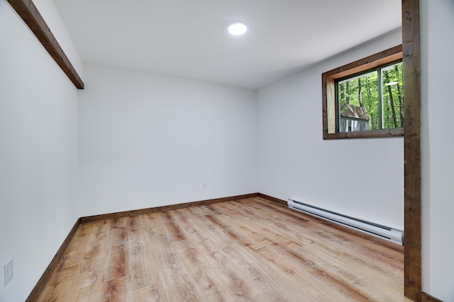 8210 Pine Grove Dr, East Stroudsburg, PA 18301 - empty room featuring a baseboard heating unit, wood finished floors, baseboards, and recessed lighting