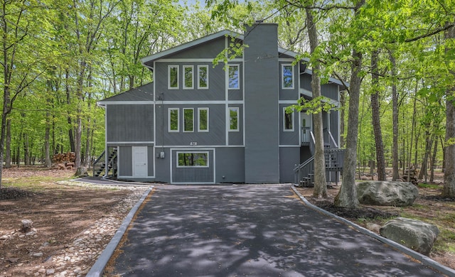 8210 Pine Grove Dr, East Stroudsburg, PA 18301 - view of front of house featuring stairway and asphalt driveway
