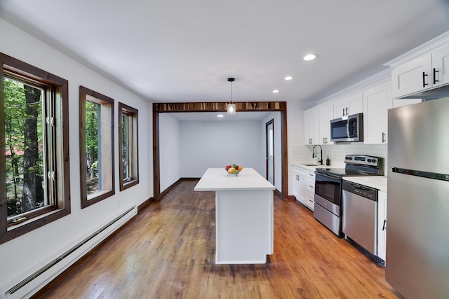 8210 Pine Grove Dr, East Stroudsburg, PA 18301 - kitchen with stainless steel appliances, a baseboard radiator, a sink, light countertops, and recessed lighting