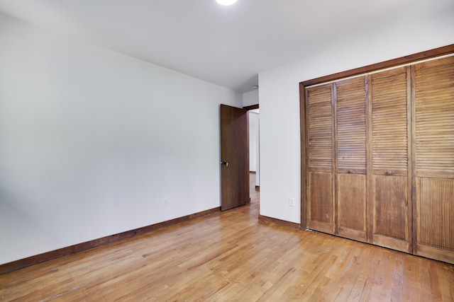 8210 Pine Grove Dr, East Stroudsburg, PA 18301 - unfurnished bedroom with light wood-type flooring, baseboards, and a closet
