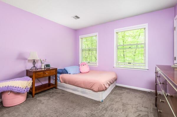 carpeted bedroom with baseboards