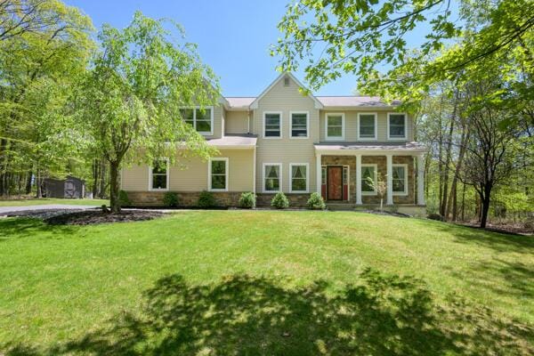 view of front of property with a front lawn and a porch