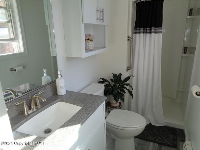 full bathroom with a baseboard radiator, vanity, toilet, and a shower with curtain