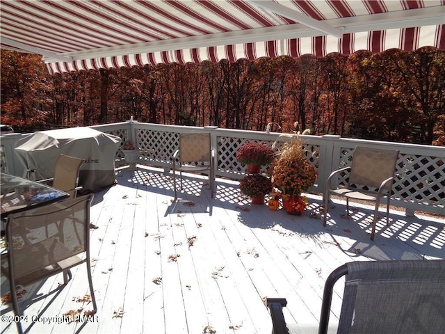 wooden terrace featuring grilling area