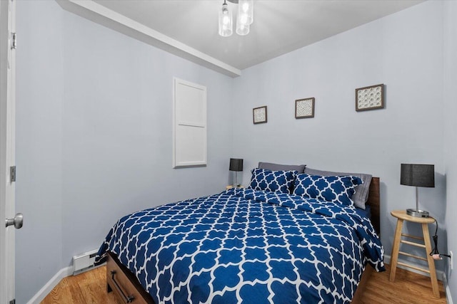 376 Linden Ct Unit 376, Tannersville, PA 18372 - bedroom featuring wood finished floors, baseboards, and a baseboard radiator
