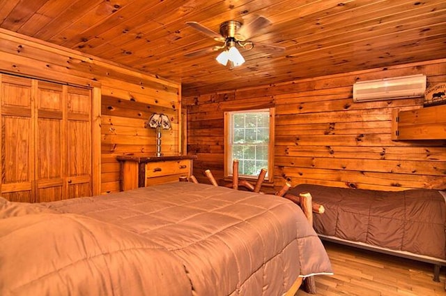 bedroom with wood finished floors, wooden ceiling, wooden walls, and a wall mounted AC