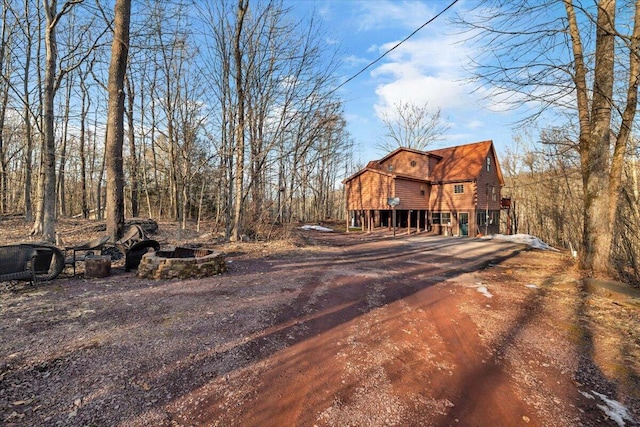 exterior space featuring dirt driveway