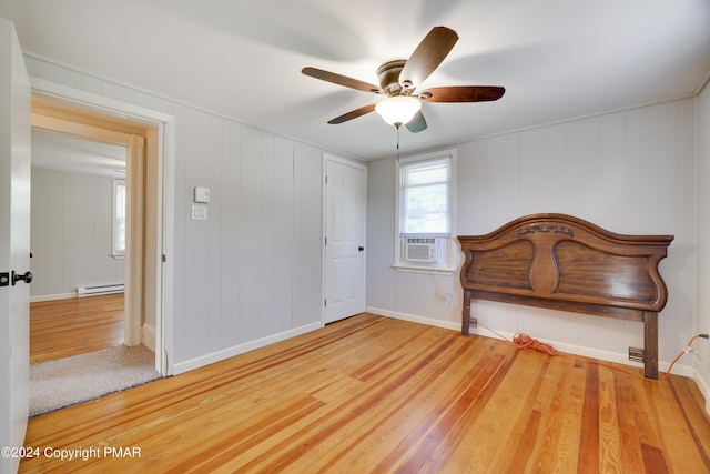 413 Old Rte 940, Pocono Pines, PA 18350 - unfurnished bedroom with wood finished floors, a baseboard radiator, cooling unit, ceiling fan, and baseboards