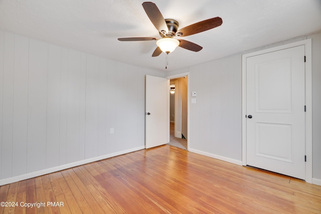 413 Old Rte 940, Pocono Pines, PA 18350 - unfurnished bedroom with light wood finished floors, baseboards, and ceiling fan