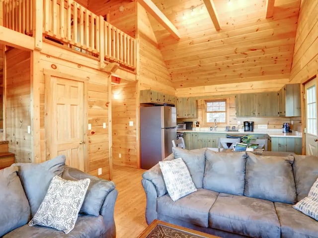 living area with high vaulted ceiling, wooden ceiling, wood walls, and light wood-style flooring