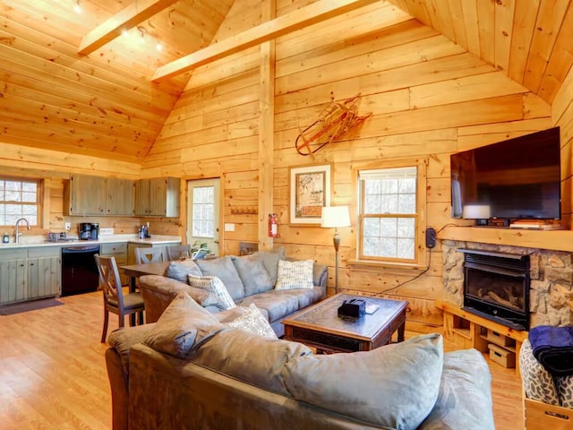 living room featuring wood walls, wood ceiling, a fireplace, and light wood-style flooring