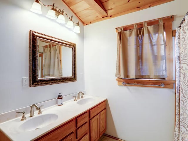 bathroom featuring double vanity, wood ceiling, and a sink