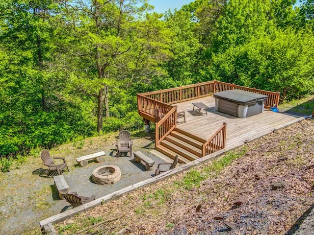 wooden terrace with an outdoor fire pit