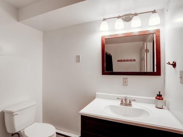 bathroom with toilet and vanity