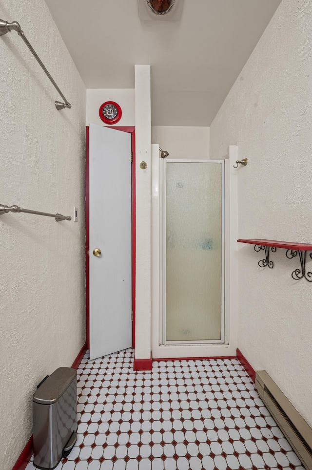1117 Belaire Dr, East Stroudsburg, PA 18301 - bathroom featuring baseboard heating and a shower stall