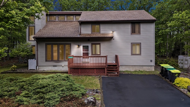 1117 Belaire Dr, East Stroudsburg, PA 18301 - back of house featuring a deck, a shingled roof, and a patio area