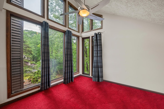 1117 Belaire Dr, East Stroudsburg, PA 18301 - unfurnished room with ceiling fan, dark carpet, healthy amount of natural light, and a textured ceiling