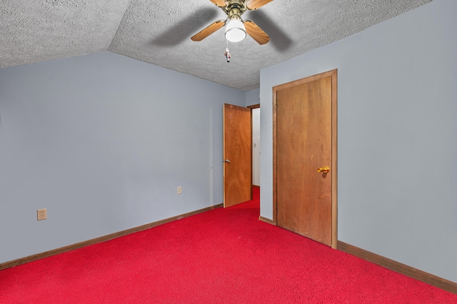 1117 Belaire Dr, East Stroudsburg, PA 18301 - unfurnished bedroom with a textured ceiling, carpet flooring, vaulted ceiling, and ceiling fan