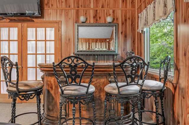 1117 Belaire Dr, East Stroudsburg, PA 18301 - dining room featuring wood walls and bar area