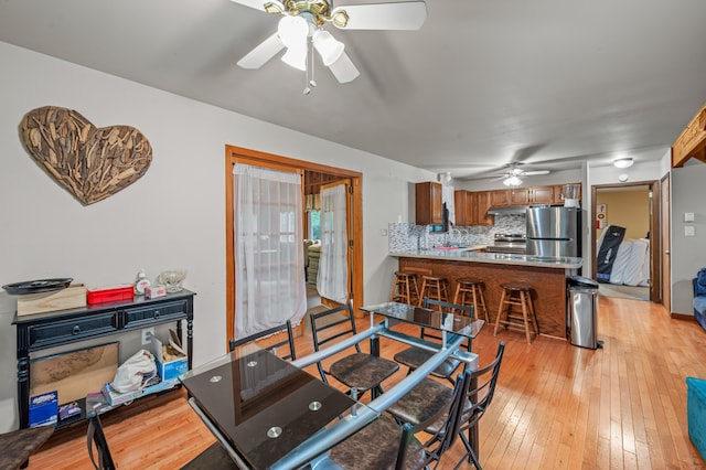 1117 Belaire Dr, East Stroudsburg, PA 18301 - dining room with a ceiling fan and light wood finished floors