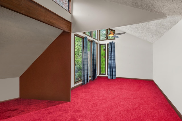 1117 Belaire Dr, East Stroudsburg, PA 18301 - bonus room featuring lofted ceiling, a textured ceiling, a ceiling fan, and carpet floors