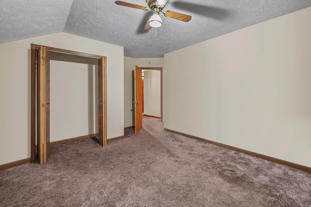 1117 Belaire Dr, East Stroudsburg, PA 18301 - unfurnished bedroom featuring a textured ceiling, carpet, ceiling fan, and lofted ceiling