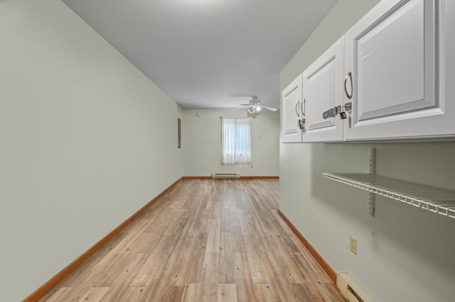 1117 Belaire Dr, East Stroudsburg, PA 18301 - spare room with light wood finished floors, a ceiling fan, and baseboard heating