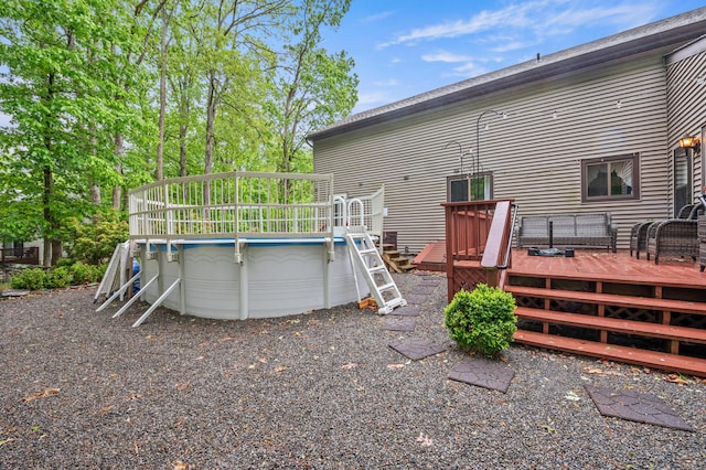 1117 Belaire Dr, East Stroudsburg, PA 18301 - rear view of property with an outdoor pool and a deck
