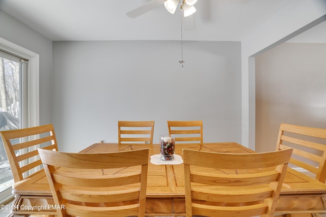 dining space with a ceiling fan