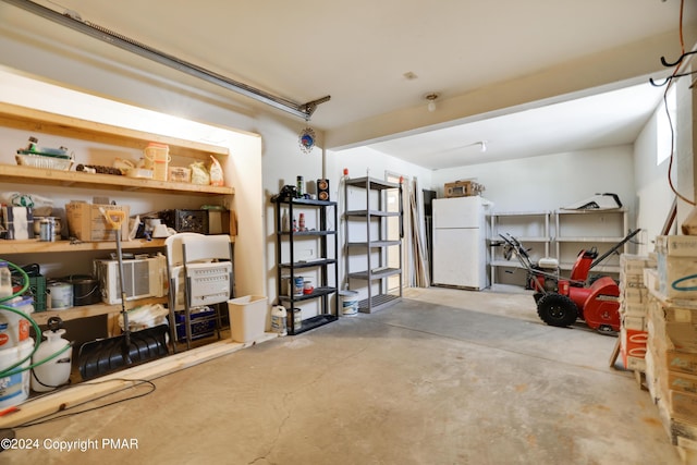 garage with freestanding refrigerator