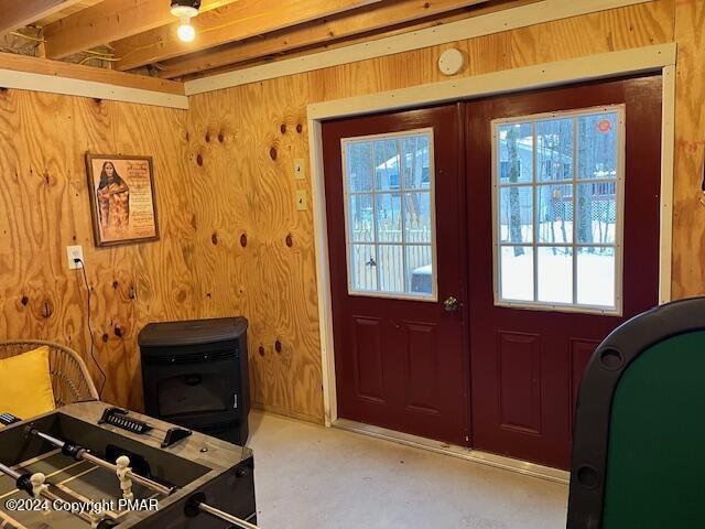 doorway featuring wood walls and french doors