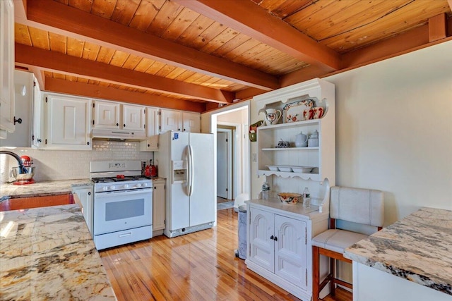 kitchen featuring tasteful backsplash, white appliances, a sink, beam ceiling, and white cabinets
