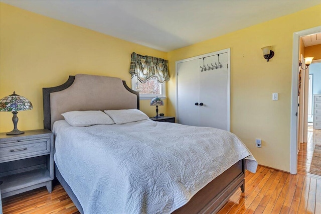 bedroom with a closet and light wood-style flooring