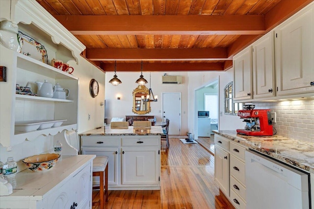 kitchen with decorative backsplash, white cabinets, dishwasher, light wood-type flooring, and an AC wall unit