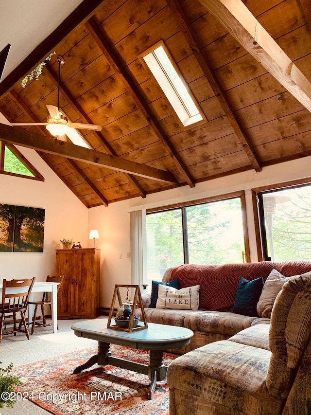 133 N Eastwood Dr, Greentown, PA 18426 - carpeted living area with plenty of natural light, beam ceiling, a skylight, and high vaulted ceiling