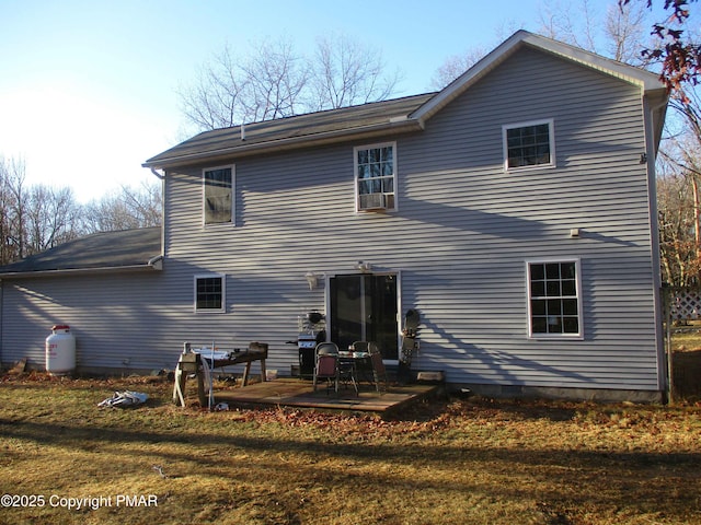 rear view of house with a yard