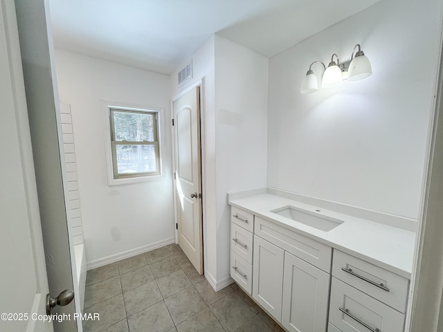 bathroom with vanity, tile patterned flooring, visible vents, and baseboards