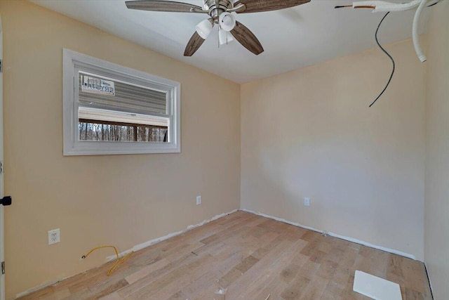 spare room featuring a ceiling fan and light wood-style floors