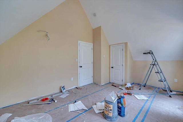 bonus room featuring high vaulted ceiling