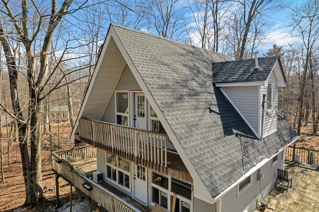 exterior space with a shingled roof