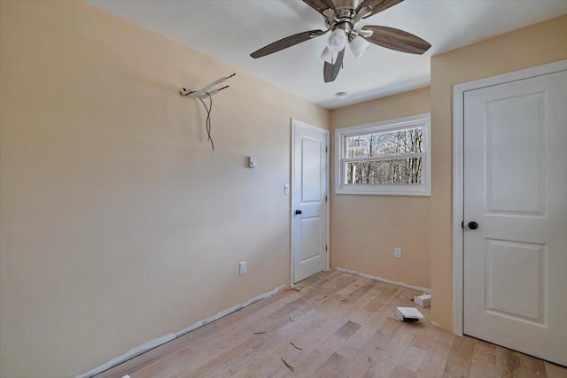 interior space with light wood-style floors and ceiling fan