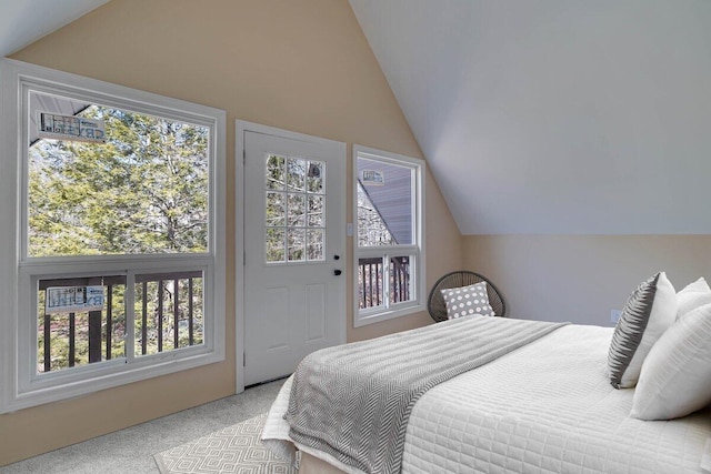 carpeted bedroom featuring vaulted ceiling