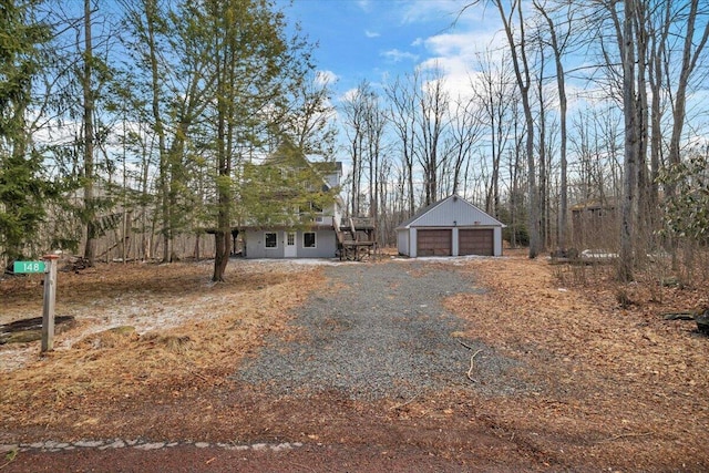 view of front of house with an outbuilding and a detached garage