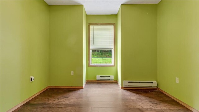 838 Cayuga Way, Stroudsburg, PA 18360 - spare room featuring a baseboard heating unit and dark wood-type flooring