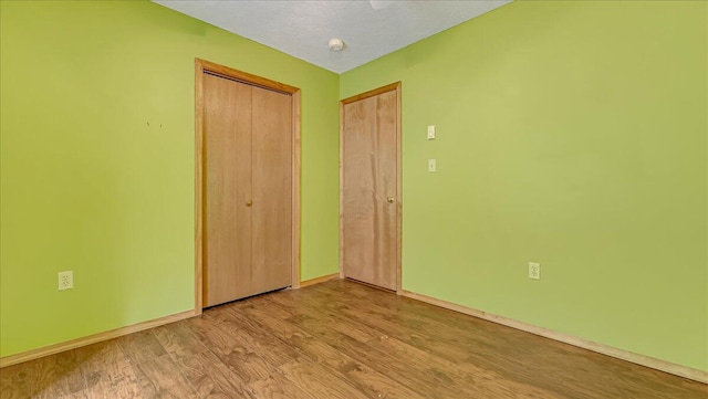 838 Cayuga Way, Stroudsburg, PA 18360 - unfurnished bedroom featuring a closet and wood finished floors