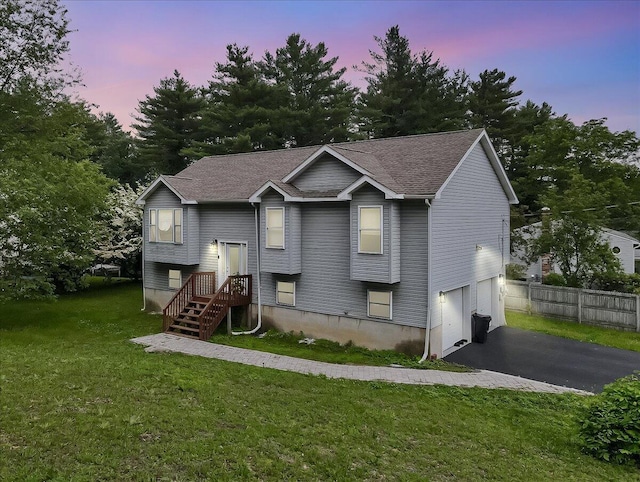838 Cayuga Way, Stroudsburg, PA 18360 - split foyer home with driveway, a garage, roof with shingles, and view of scattered trees