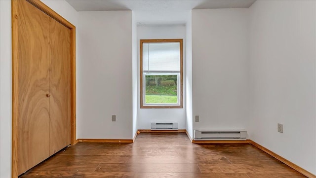 838 Cayuga Way, Stroudsburg, PA 18360 - unfurnished bedroom featuring baseboard heating, a baseboard heating unit, dark wood-style floors, and a closet