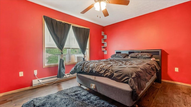 838 Cayuga Way, Stroudsburg, PA 18360 - bedroom with a baseboard radiator, wood finished floors, and ceiling fan