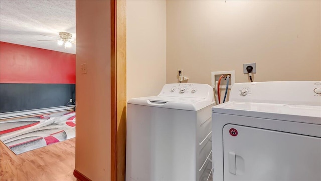 838 Cayuga Way, Stroudsburg, PA 18360 - laundry area with baseboard heating, independent washer and dryer, ceiling fan, and wood finished floors